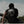 Load image into Gallery viewer, Athlete sitting outdoors wearing black RULERS t-shirt with Jiu-Jitsu Every Day mind illustration on the back